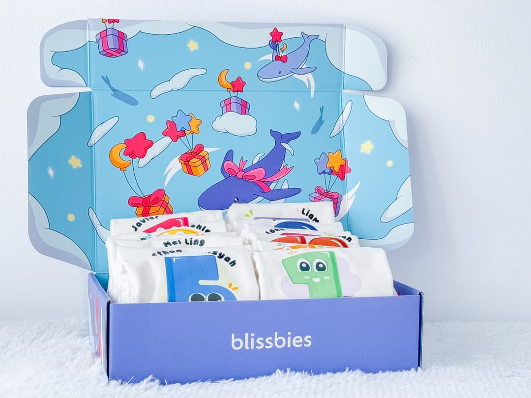 Blissbies Baby 1–12 Months Milestone Rompers, a set of personalised monthly rompers in a gift box