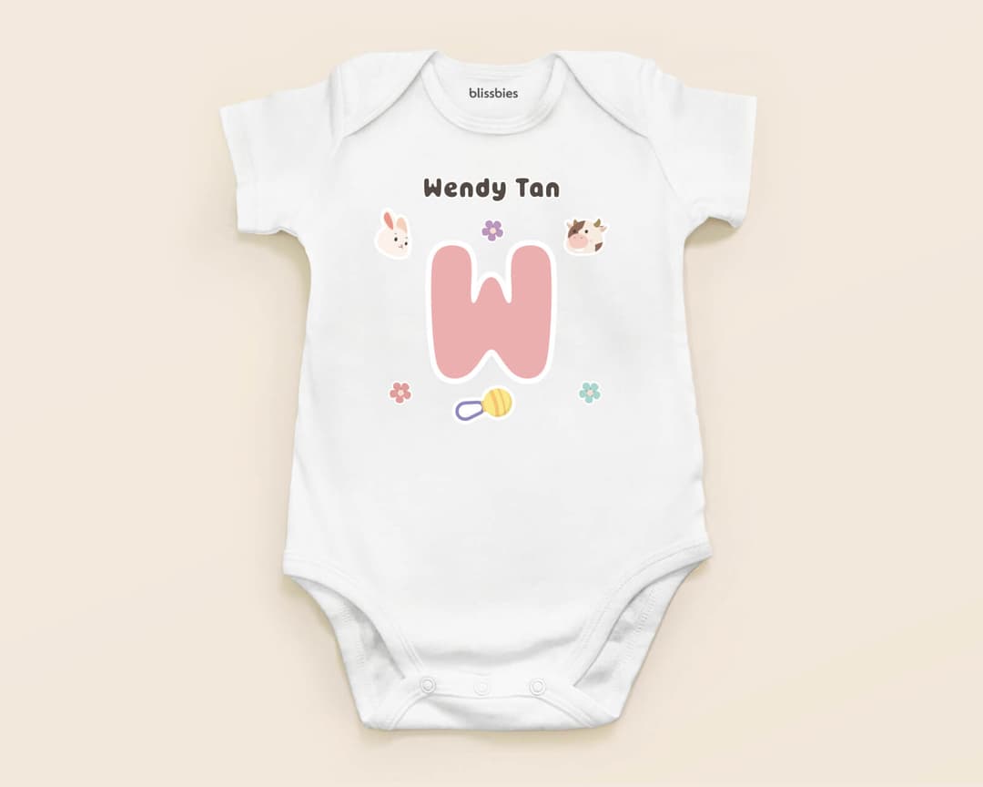 Blissbies personalised baby romper in white with a printed design and the baby's name