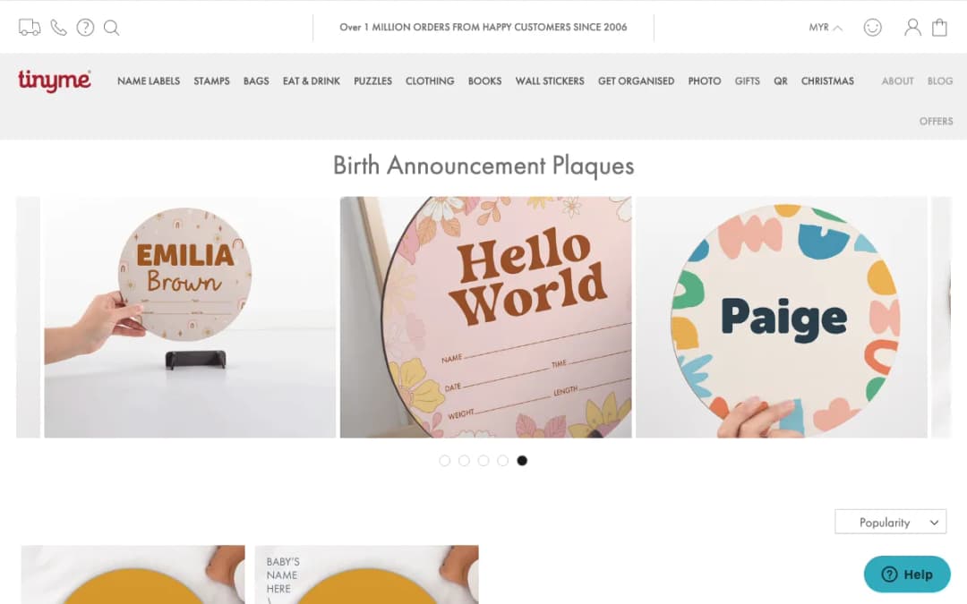 Screenshot of the Tinyme Malaysia birth announcement plaques page with personalised wooden plaques, taken 17 Oct 2026
