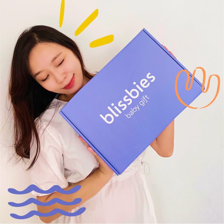 Jamie from Blissbies holding a Blissbies baby gift box