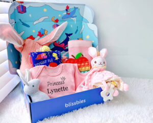 Pink strawberry personalised baby gift set with romper, bib, comforter, apple popper