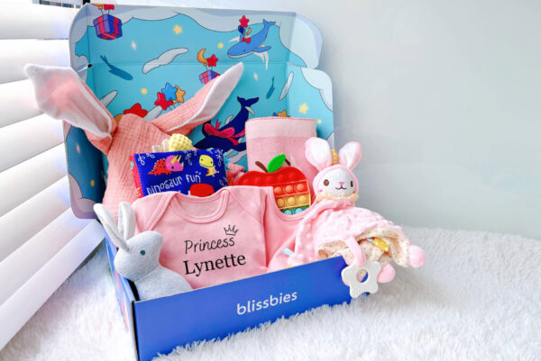 Pink strawberry personalised baby gift set with romper, bib, comforter, apple popper
